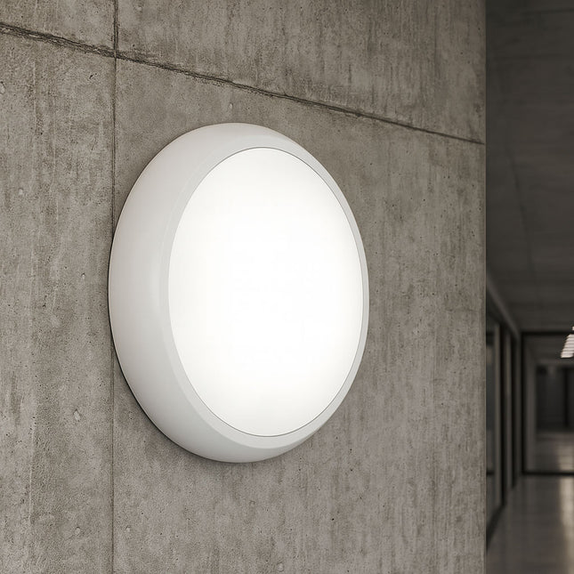 Round wall-mounted light fixture on a concrete wall