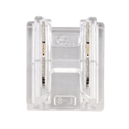 Clear plastic component with metallic elements on a white background