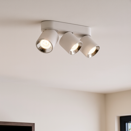 Ceiling light fixture with three lights on a white ceiling