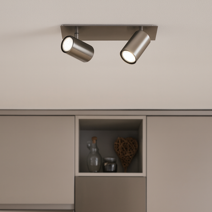 Modern kitchen with gray cabinets and a ceiling light fixture.