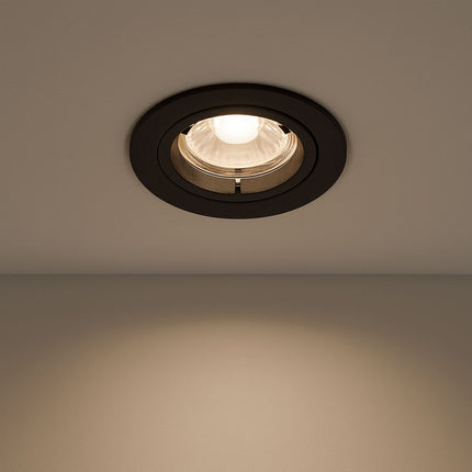 Recessed ceiling light fixture on a plain wall