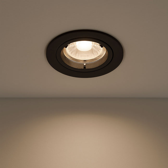 Recessed ceiling light fixture on a plain wall
