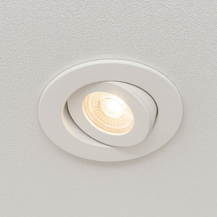 White recessed ceiling light on a gray background