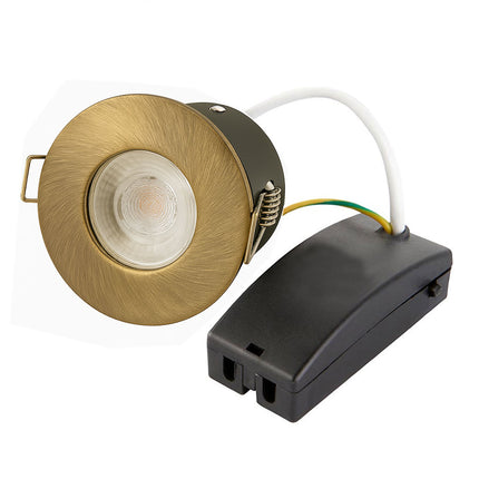 Antique brass recessed light fixture and black electrical box on a white background
